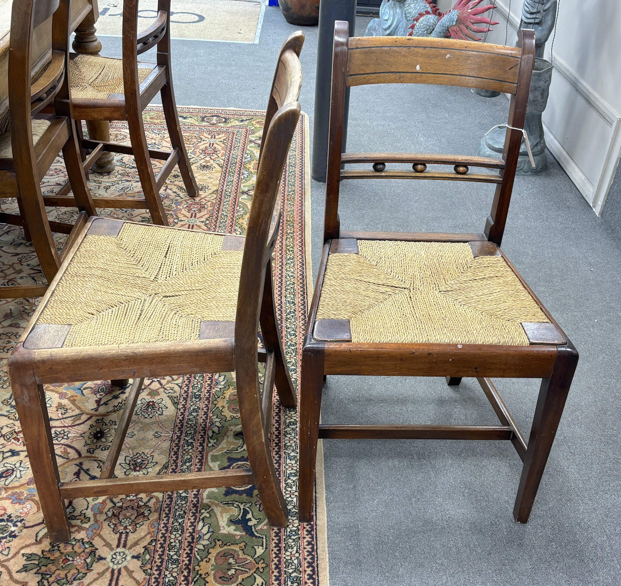 A set of nine early 19th century Provincial mahogany rush seat dining chairs, width 47cm, depth 38cm, height 86cm